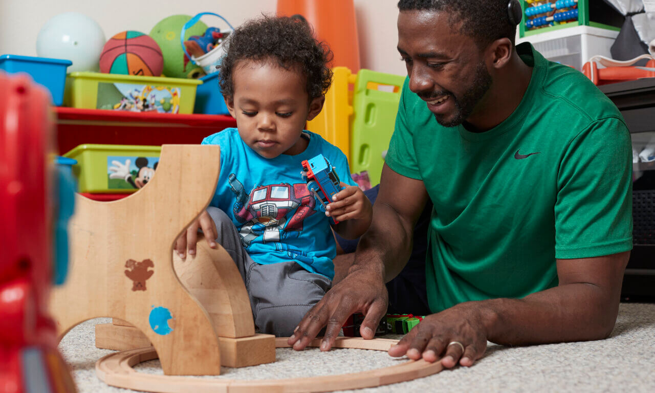 Man playing with child